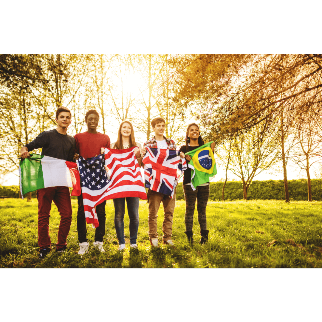 Five international students each hold the flag of their native country.